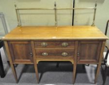 A Georgian style mahogany sideboard, with gilt-metal gallery with urn finials,