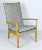 A Parker Knoll chair, teak structure, with two upholstered cushions,