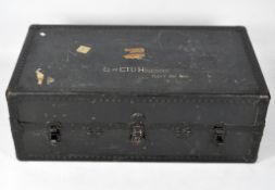 An early 20th century wardrobe/travelling trunk, with rivetted decoration,