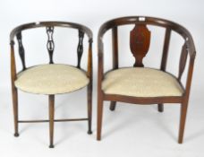 A matched pair of late 19th/early 20th century mahogany tub chairs, with cream upholstered seats,