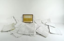 A collection of white linen, many with lace and whitework details,