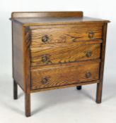 An oak three drawer chest, 20th century, on square legs