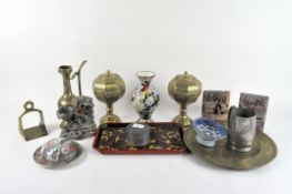 A collection of Chinese metalware including a carved dish and a lidded pot,
