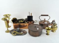 A collection of metalware, including a copper kettle, brass ash trays,