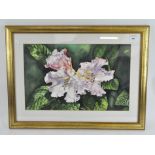 A contemporary watercolour depicting a floral still life, framed and glazed,