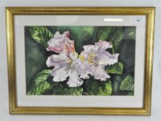 A contemporary watercolour depicting a floral still life, framed and glazed,