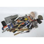 A selection of modern tools including planes, clamps,