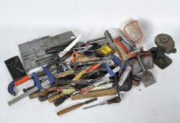 A selection of modern tools including planes, clamps,