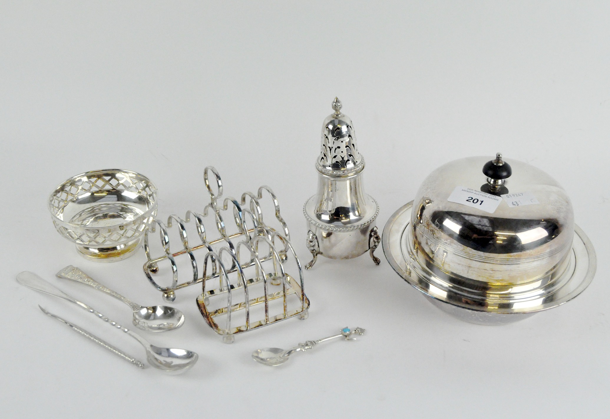 A collection of 20th Century silver plate including two toast racks, spoons,