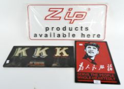 A French advertising sign, 'KKK' painted onto a wooden board with two contemporary metal signs