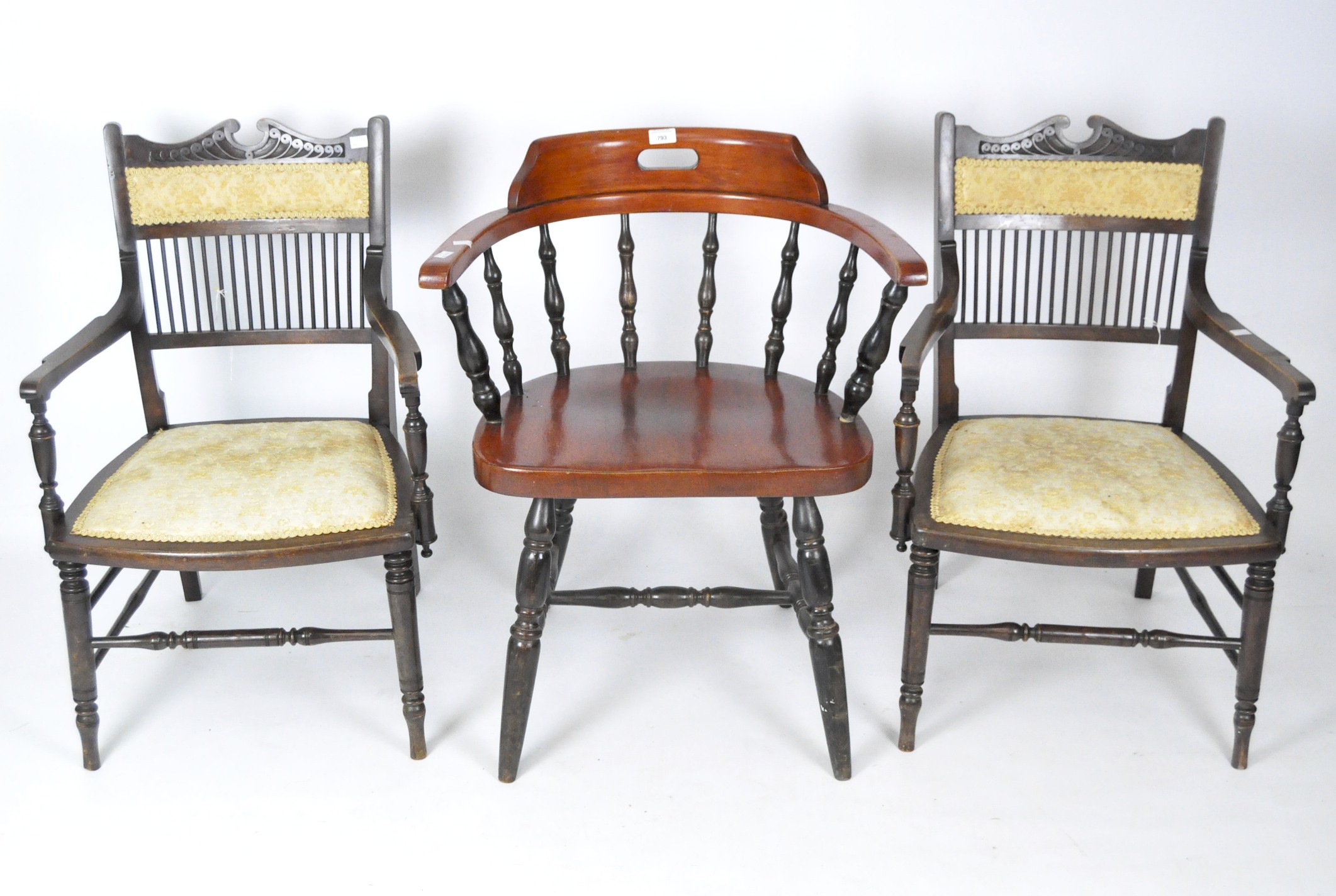 A group of three mahogany chairs, including one tub and a pair of armchairs,