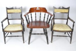 A group of three mahogany chairs, including one tub and a pair of armchairs,