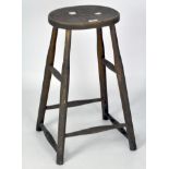 A vintage wooden bar stool, on turned supports,