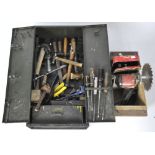 A metal wall cabinet and a selection of tools,