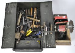 A metal wall cabinet and a selection of tools,