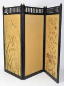 A Victorian Aesthetic Movement style japanned tri-parte room divider, with spindle top,