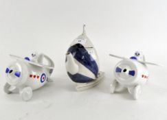 A group of three ceramic novelty tea pots and a similar ceramic yacht