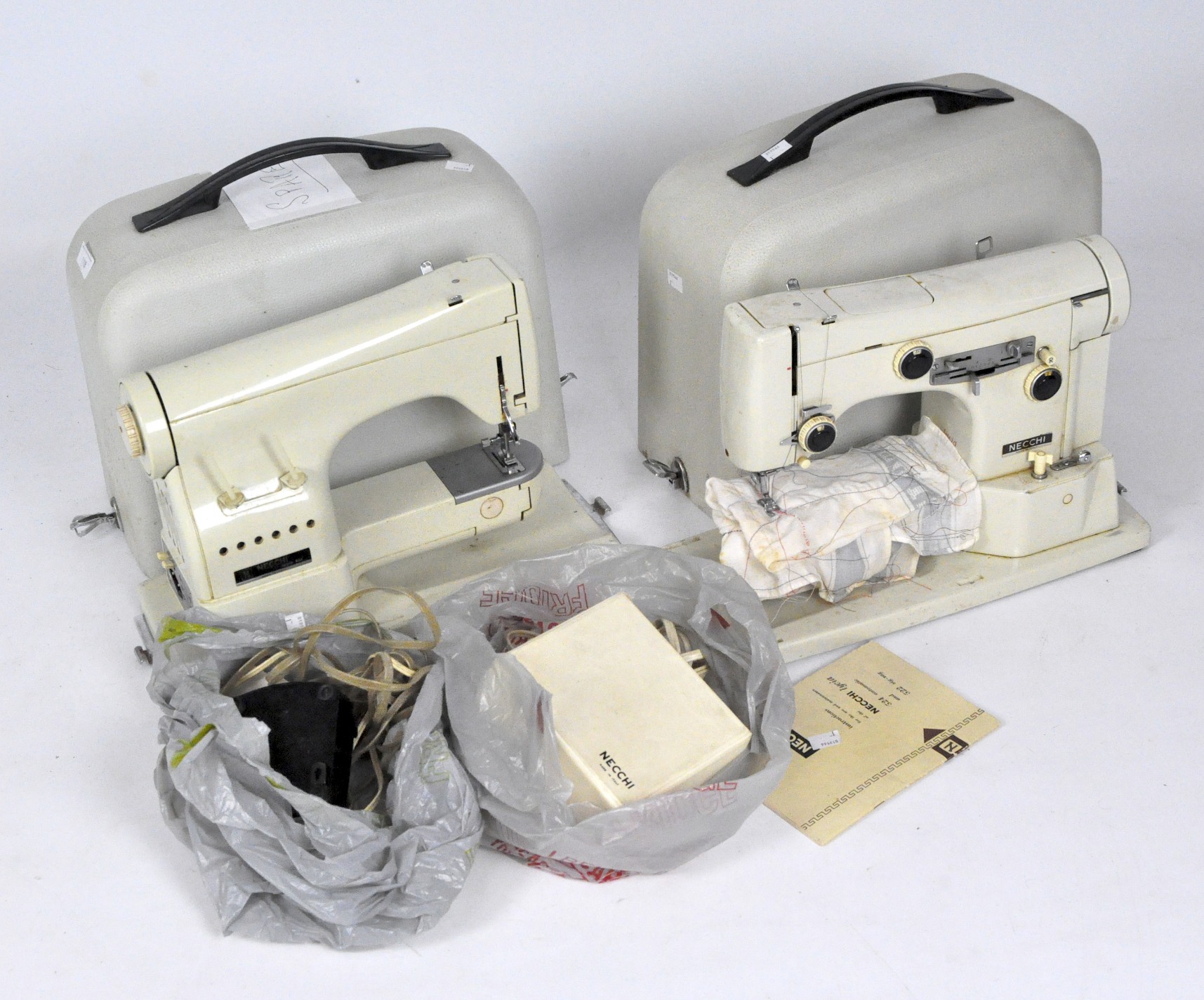Two Necchi vintage sewing machines, in the original cases,