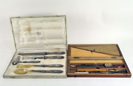 A mahogany cased drawing set, together with a cased set of French silver plated serving utensils,