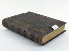 A Victorian leather bound photograph album,