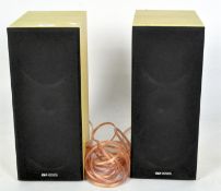 A pair of Acoustic Solutions speakers, in wooden cases, model no AV-150B,