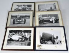 A group of six black and white vintage automobile photographs, each mounted in frames,