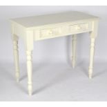 A white painted pine side table, with two single drawers to the front, raised upon turned supports,