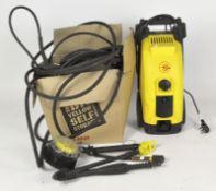 A Karcher 620M pressure washer and associated fittings and tools