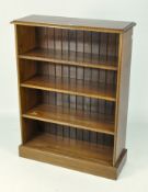 An early 20th century stained oak bookcase, with four shelves,