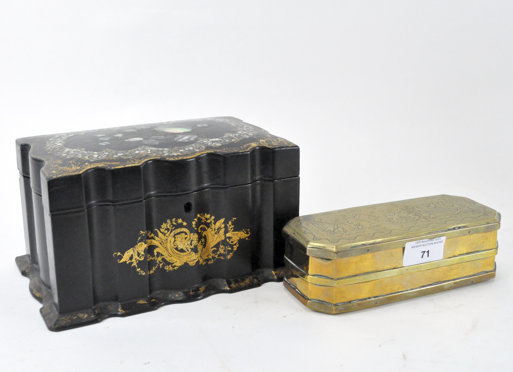 A Victorian papier mache tea caddy with mother of pearl inlay together with a brass cigar box