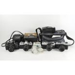 A selection of vintage cameras to include Practica and Minolta examples.