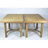 A pair of extendable pine dining tables, with cross banding supports,