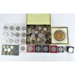 A collection of vintage coins including a Churchill and Windsor fire coin,