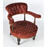 A 19th Century red upholstered button back tub chair
