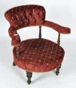 A 19th Century red upholstered button back tub chair