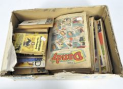 A collection of vintage comic books, including Battle and Dandy,