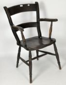 A late 19th century wooden arm chair,