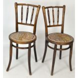 A pair of late 19th/early 20th century mahogany chairs, raised upon tapering legs, upholstered seat,