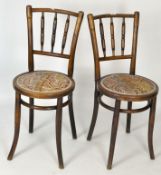 A pair of late 19th/early 20th century mahogany chairs, raised upon tapering legs, upholstered seat,
