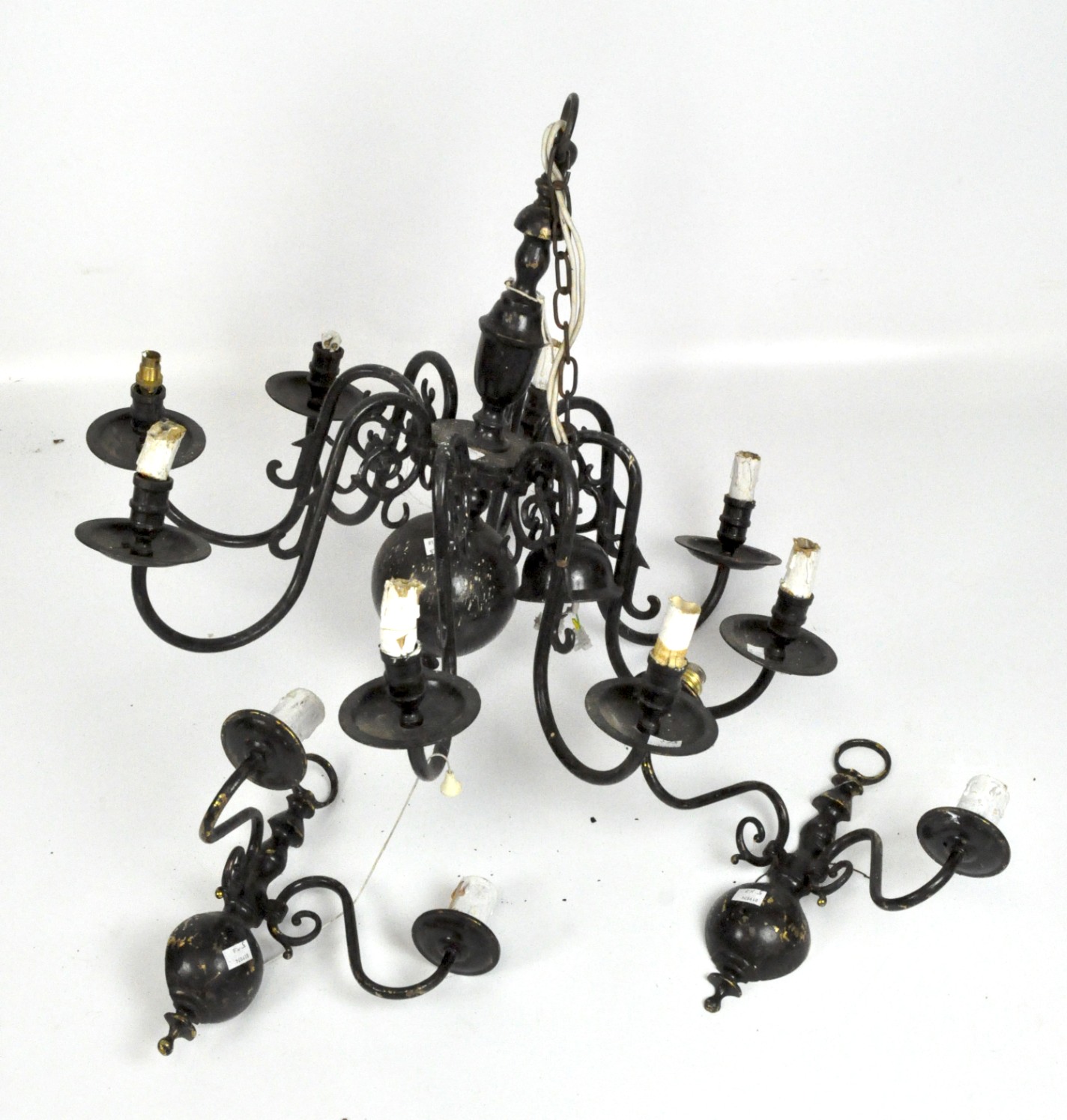 An eight branch Dutch style black painted metal chandelier with a matching pair of wall sconces