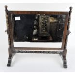 A 20th Century dressing table mirror, mahogany frame with turned details and cabriole feet,