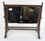 A 20th Century dressing table mirror, mahogany frame with turned details and cabriole feet,