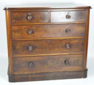 A early 20th Century mahogany chest of drawers, curved edges,
