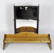 A contemporary pine book shelf, 92cm wide, together with a Victorian mahogany dressing table mirror,