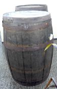 Two coopered wooden barrels,