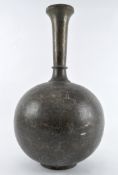 A large Middle Eastern brass pot, highly decorated throughout with hammered and engraved motifs,