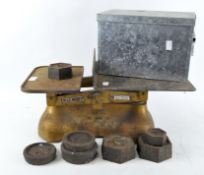 A set of W & T Avery Ltd scales with assorted weights