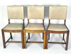 Three oak dining chairs with beige drop in vinyl seats,