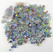 A collection of vintage marbles, of assorted sizes and designs,
