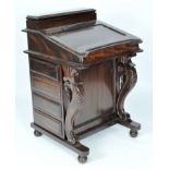 A reproduction mahogany davenport, the lid opening to reveal eight fitted drawers,